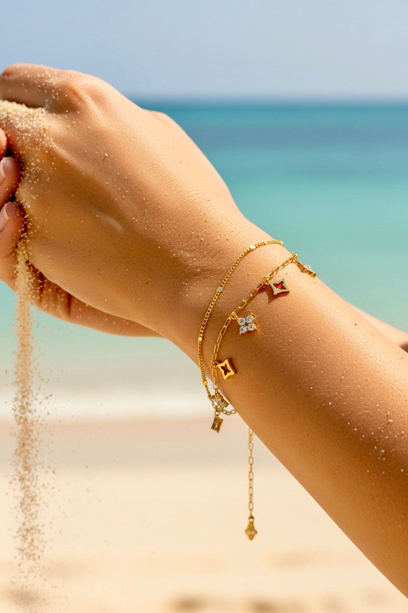 Bracelet double rang breloques étoiles et losanges