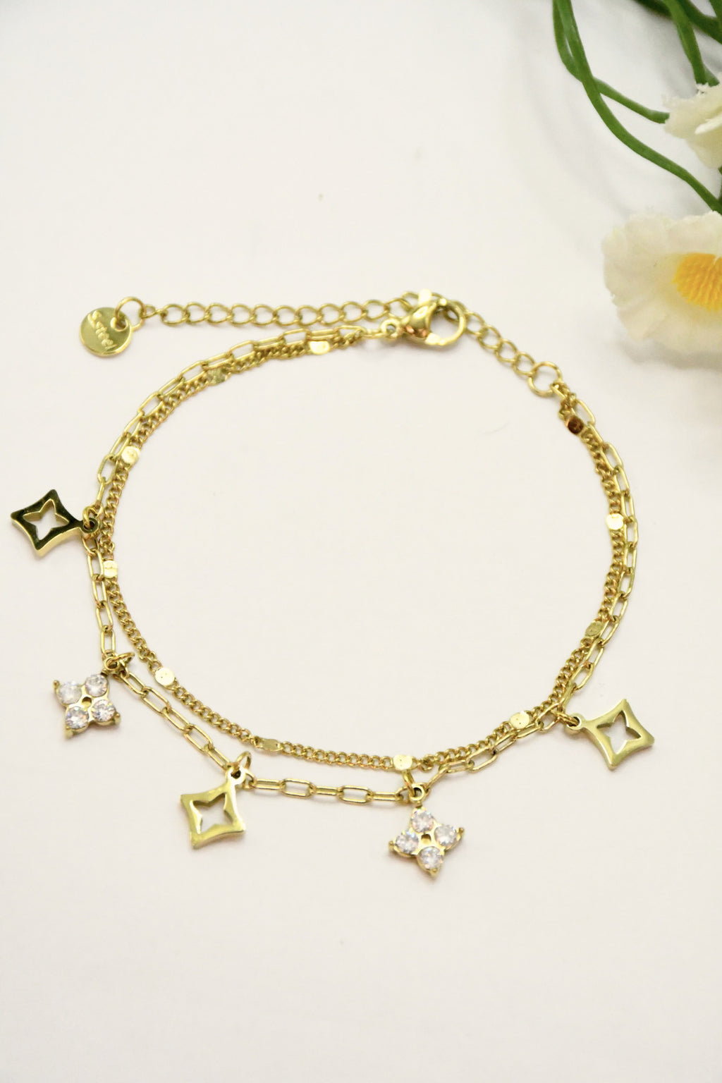Bracelet double rang breloques étoiles et losanges